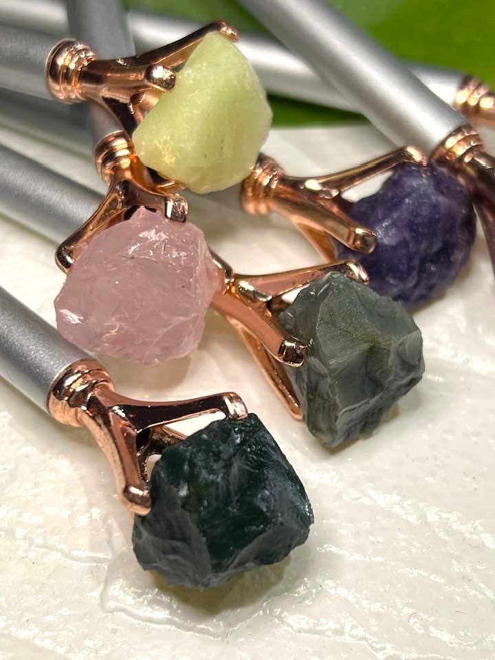 Pen with a crystal, rock or stone topper
